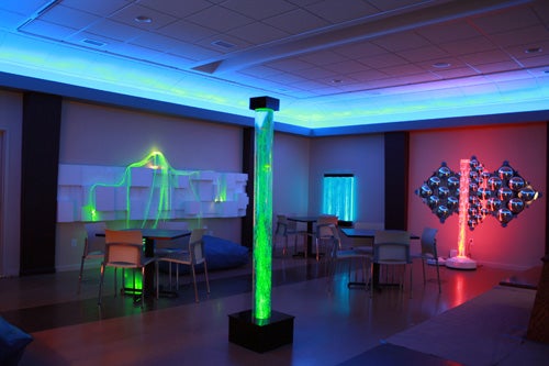 Subdued lighting, fiber-optic lights, and bubble tubes resembling giant lava lamps are just some of the innovations Kijeong Jeon devised for this room in the COVE. Nonstructural pilasters along the edges of the room give people with autism a sense of added security. Photo courtesy Kijeong Jeon.