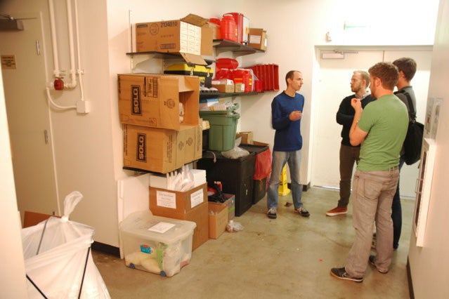 Architecture graduate students talk to a Portland-area micro-entrepreneur about his space.