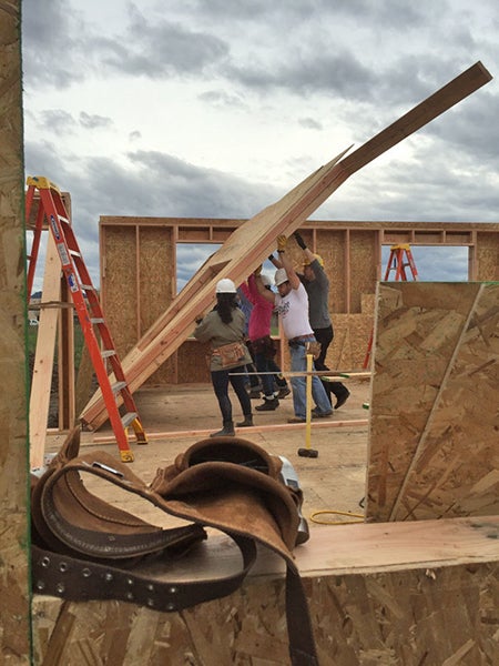 Students raise a wall during construction of the OregonBILDS house in 2016