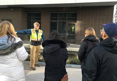 Tom Puttman explains water systems during a studio field trip