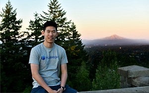 Photo of Jordan Paing in front of Portland Skyline