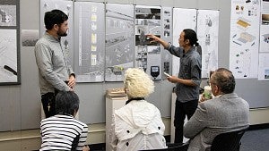students discuss work at architecture review