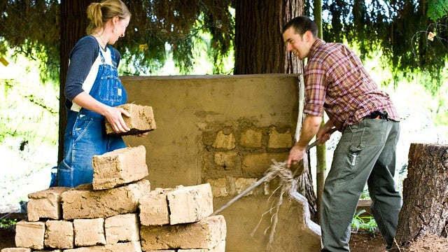 two students move bricks
