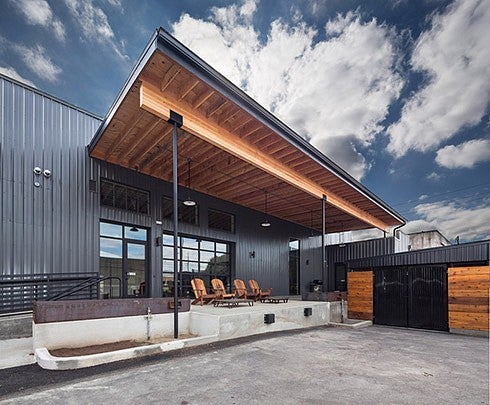 store with awning and chairs