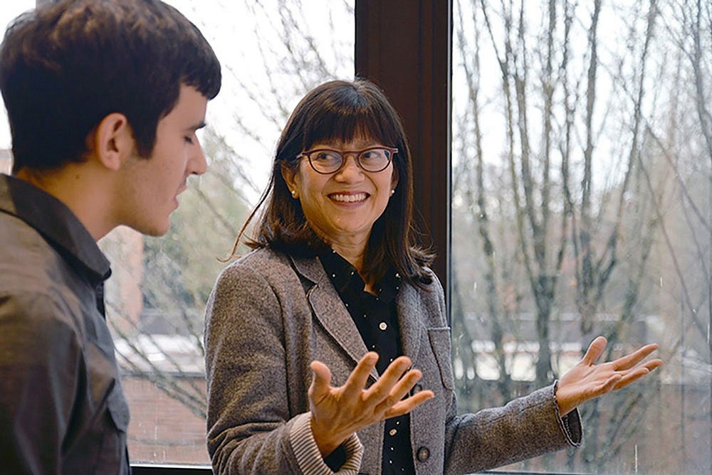 Professor Alison Kwok speaks with student
