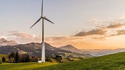 photo of wind turbine in the mountains