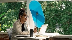 Photo of person at desk with a Taskshade