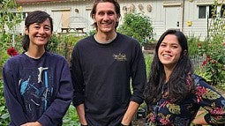 Photo of three students at the UO Urban Farm
