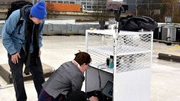 Students working on project on roof top