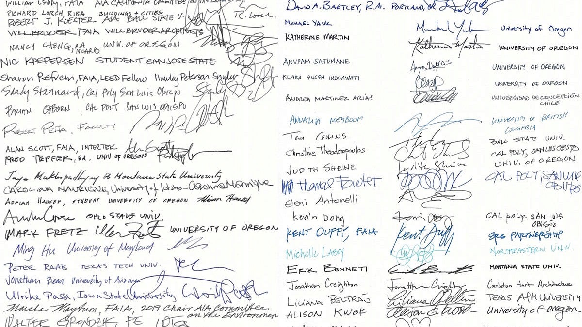 Image of two sheets of paper filled with signatures