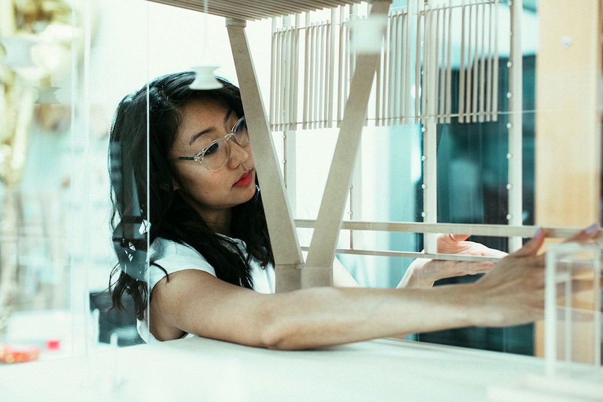 Photo of Talisa Shevavesh with her architectural model