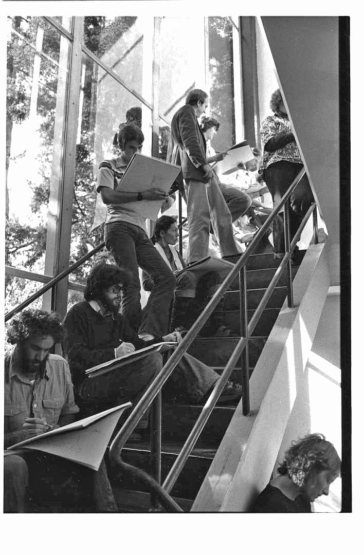 Photograph of students in a stairwell.
