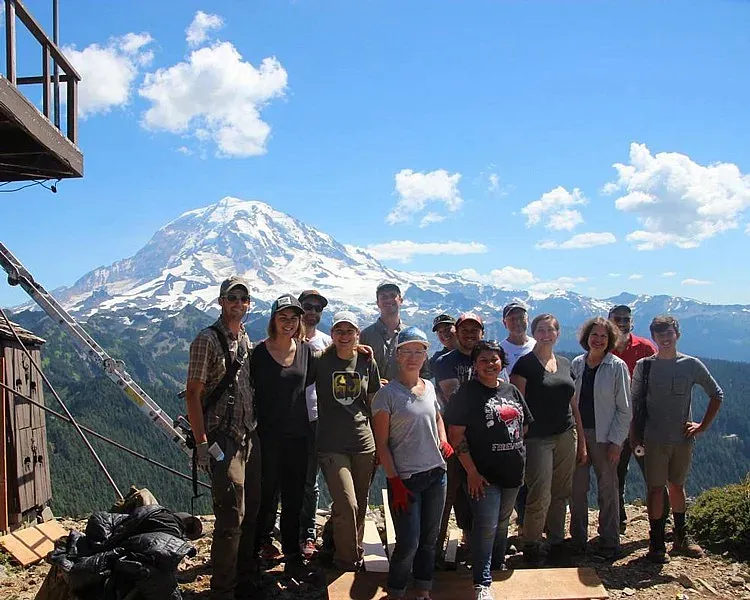 Students in front of a mountain