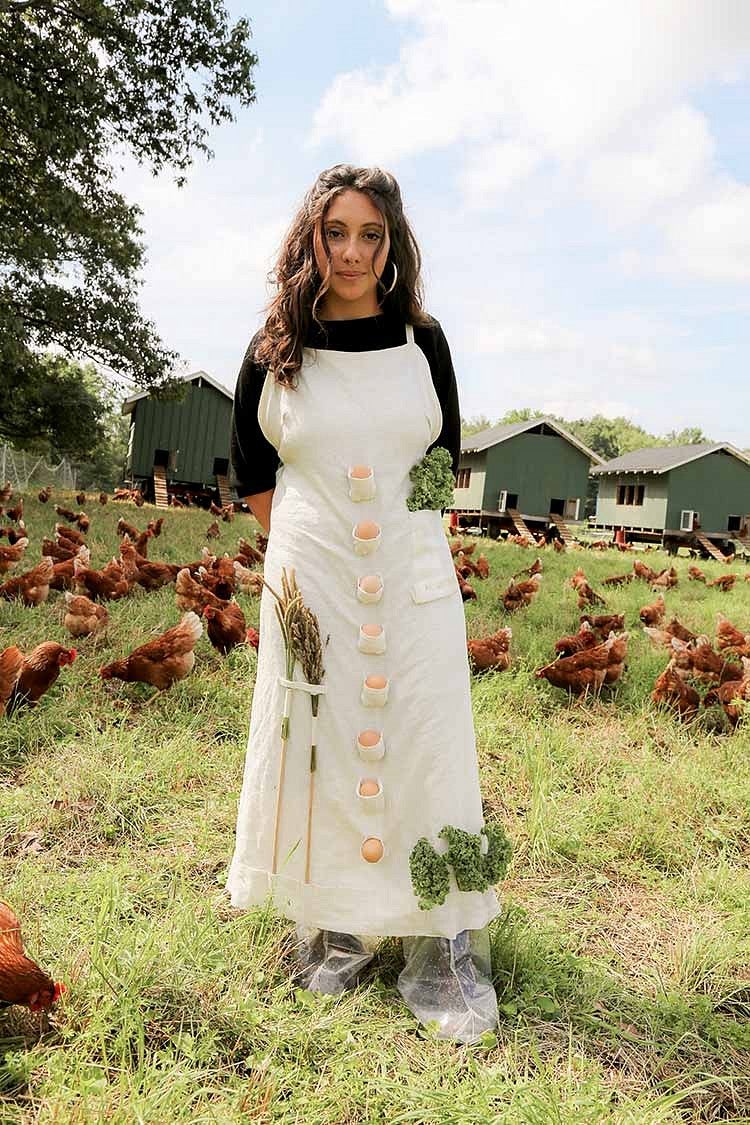 woman in field with tools