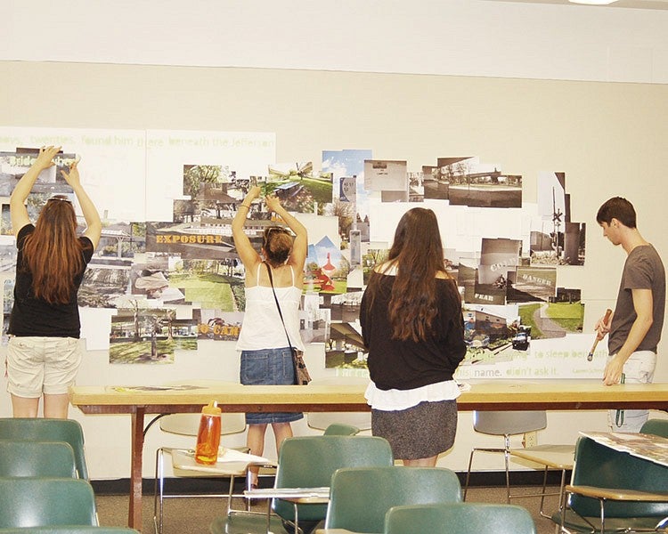 students hang review boards