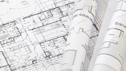 Photograph of housing plans. 