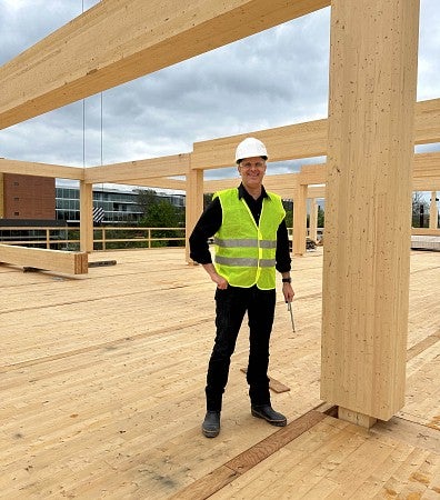 Photograph of new SAE head, Uli Dangel, at a worksite. 