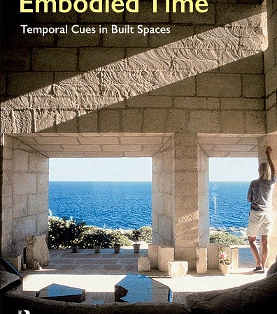 Cover for the Embodied Time book by Kevin Nute. Shows an interior stone space with open windows and a man leaning against an opening that opens into an ocean view. 