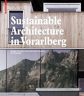 The book cover for Dangel's book, "Sustainable Architecture in Vorarlberg". Shows a modern designed home/building that shows a mountain range reflected in the large windows near the bottom of the cover.